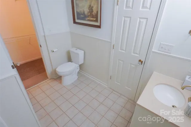 a bathroom with a toilet and a sink