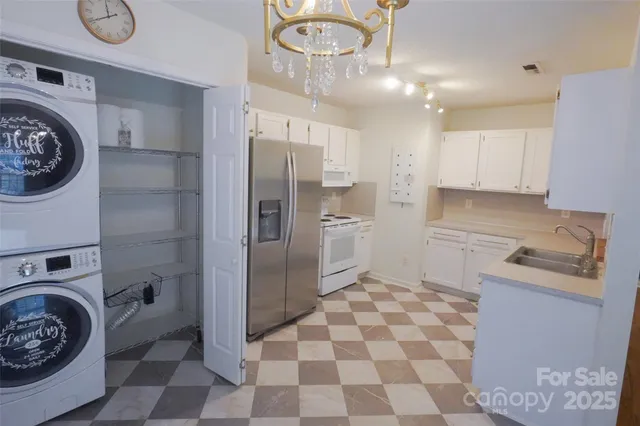 a kitchen with a cabinets and a stove top oven