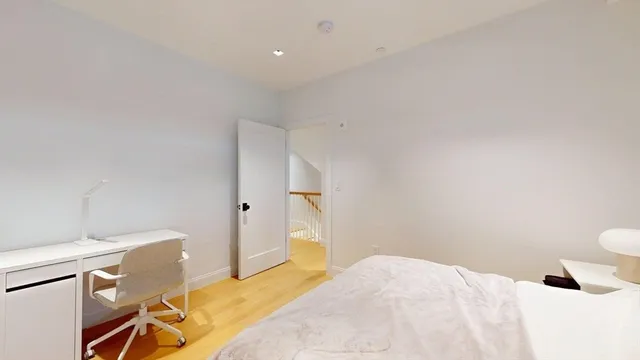 a bedroom with a bed and a cabinets