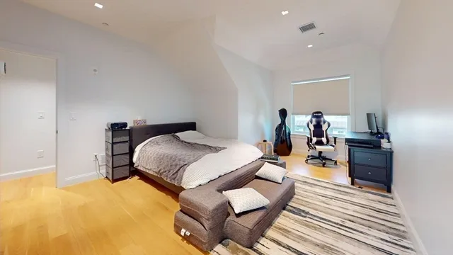 a bed room with a bed and furniture