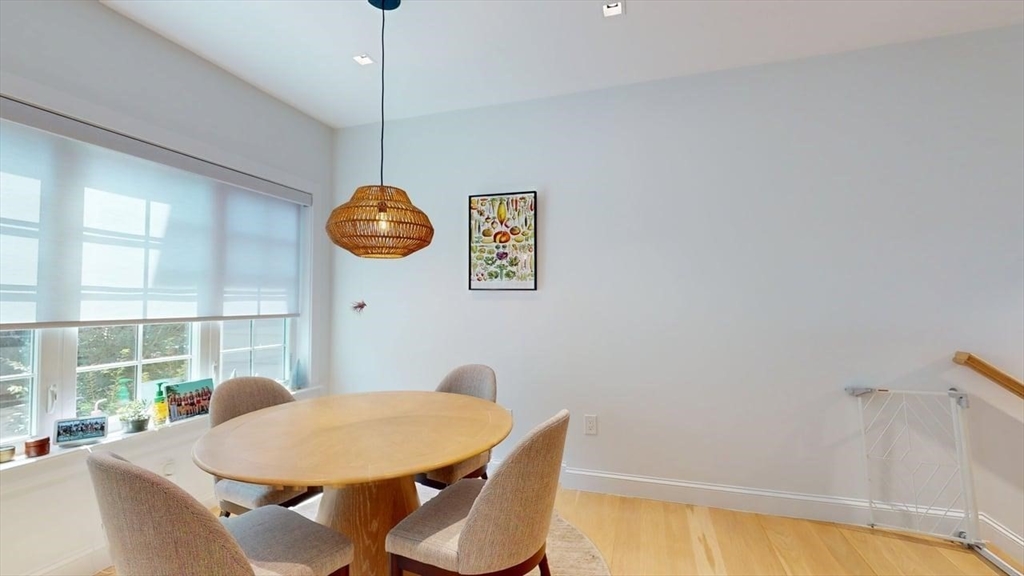 21 Crowninshield Road, Unit 17 Brookline, MA 02446 - Photo 7 of 29 a view of a dining room with furniture and window