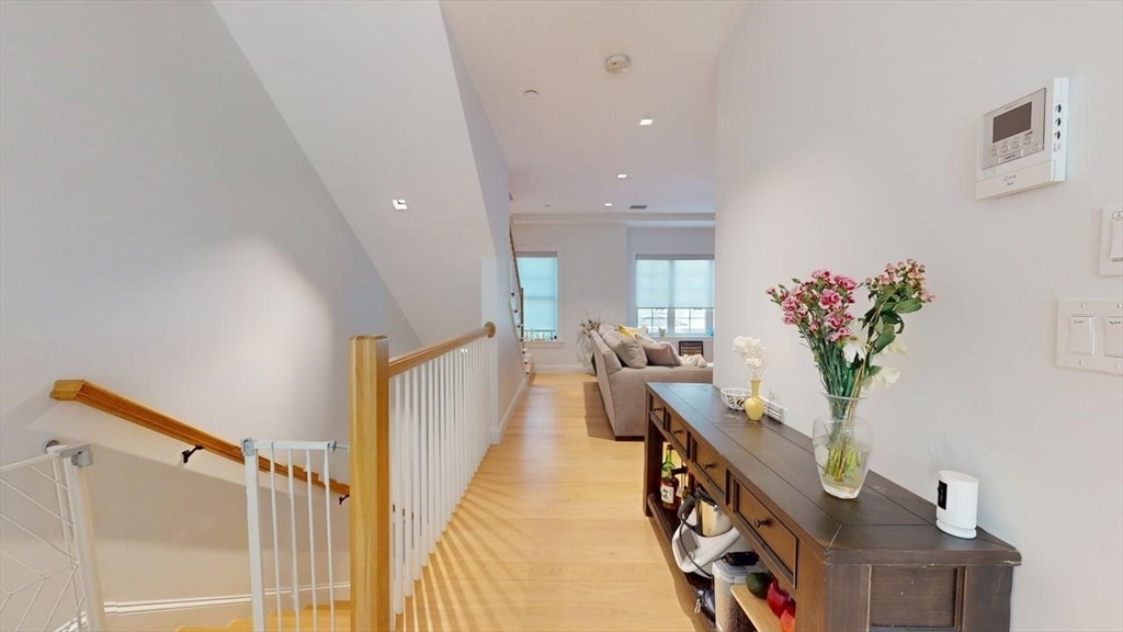 21 Crowninshield Road, Unit 17 Brookline, MA 02446 - Photo 9 of 29 a view of living room and kitchen