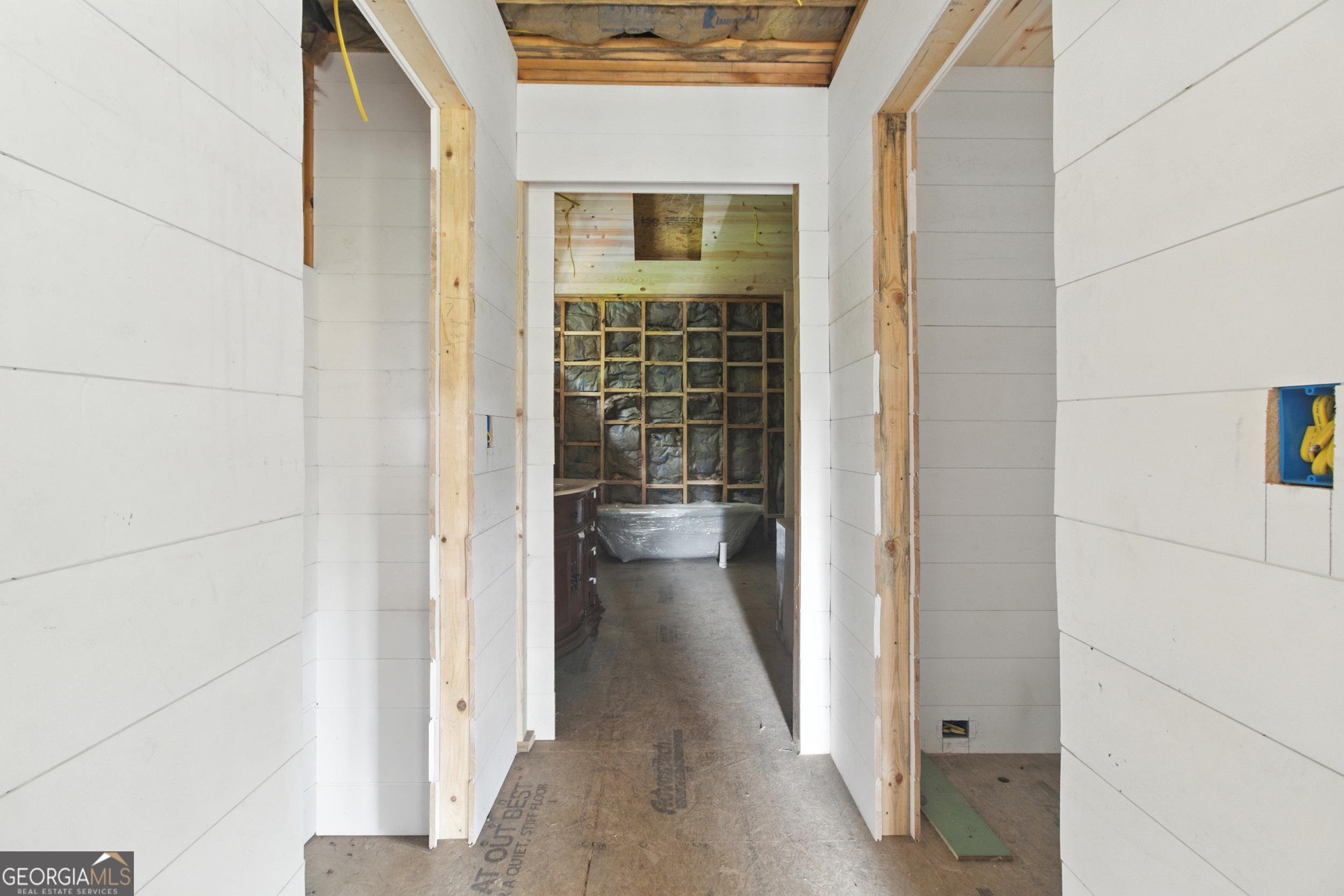 668 Mountainside Drive Rabun Gap, GA 30568 - Photo 11 of 24 a view of a hallway with a wooden door