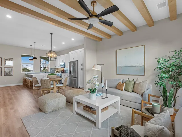 a kitchen with a sink a stove and cabinets