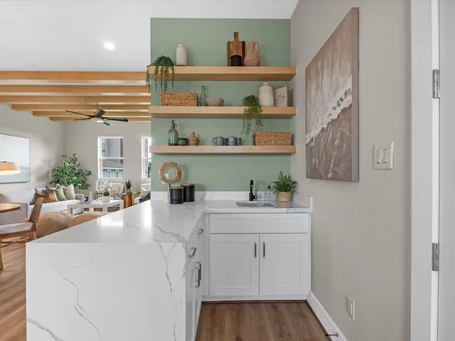 a bathroom with a sink a toilet and vanity
