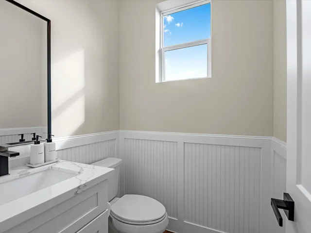 a bed room with bed and a window