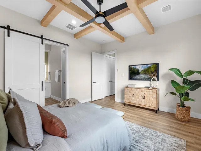 a bathroom with a double vanity sink mirror and bathtub