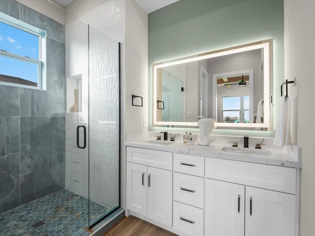 a bathroom with a shower and a sink