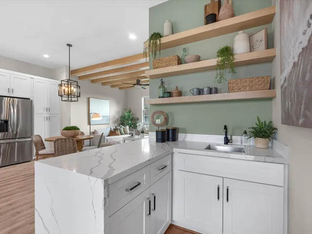 a kitchen with a sink and a refrigerator