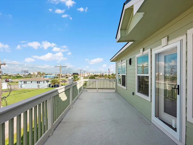 a view of a balcony with a potted plant
