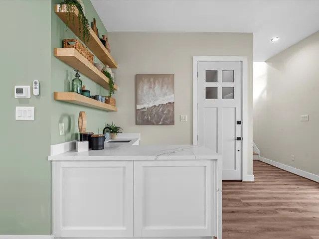 a bathroom with a sink a mirror and a shower
