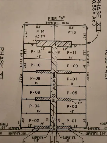 a front view of multi story residential apartment building with yard