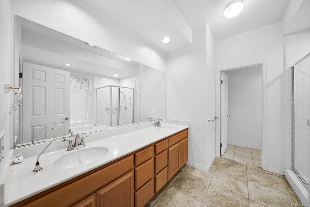 1861 Fox Bridge Court Fallbrook, CA 92028 - Photo 19 of 60 a spacious bathroom with a double vanity sink mirror and double