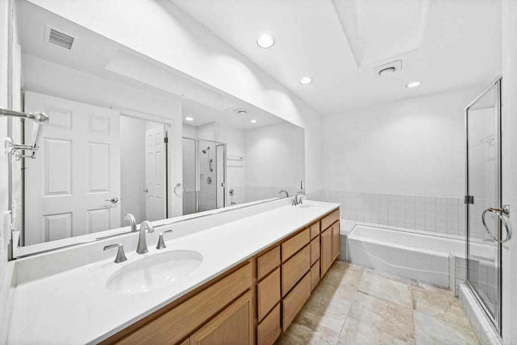 1861 Fox Bridge Court Fallbrook, CA 92028 - Photo 26 of 60 a bathroom with a granite countertop sink mirror and a bath tub