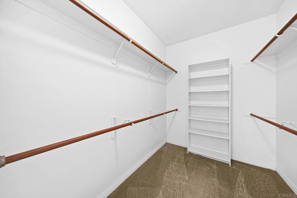 1861 Fox Bridge Court Fallbrook, CA 92028 - Photo 29 of 60 a view of walk in closet with empty racks