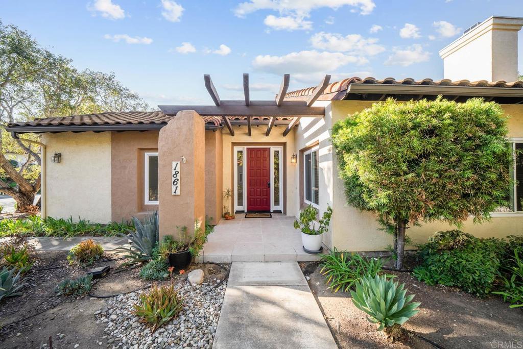 1861 Fox Bridge Court Fallbrook, CA 92028 - Photo 3 of 60 a front view of a house with garden