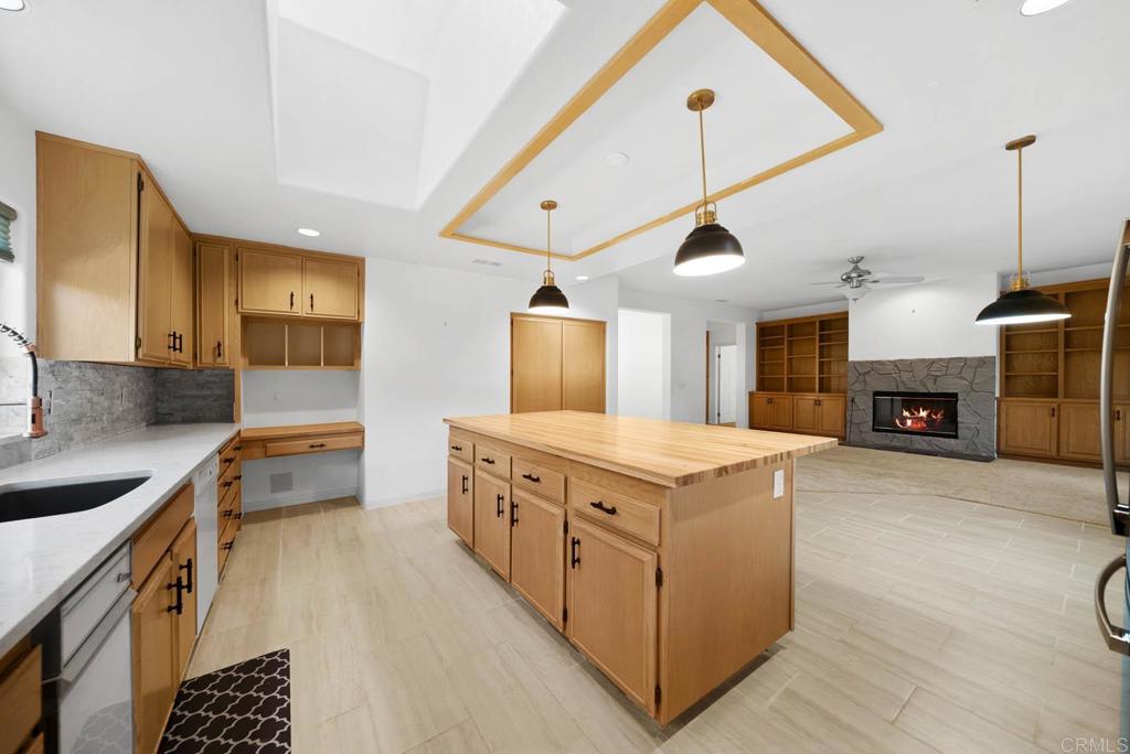 1861 Fox Bridge Court Fallbrook, CA 92028 - Photo 8 of 60 a kitchen with stove a sink and a refrigerator