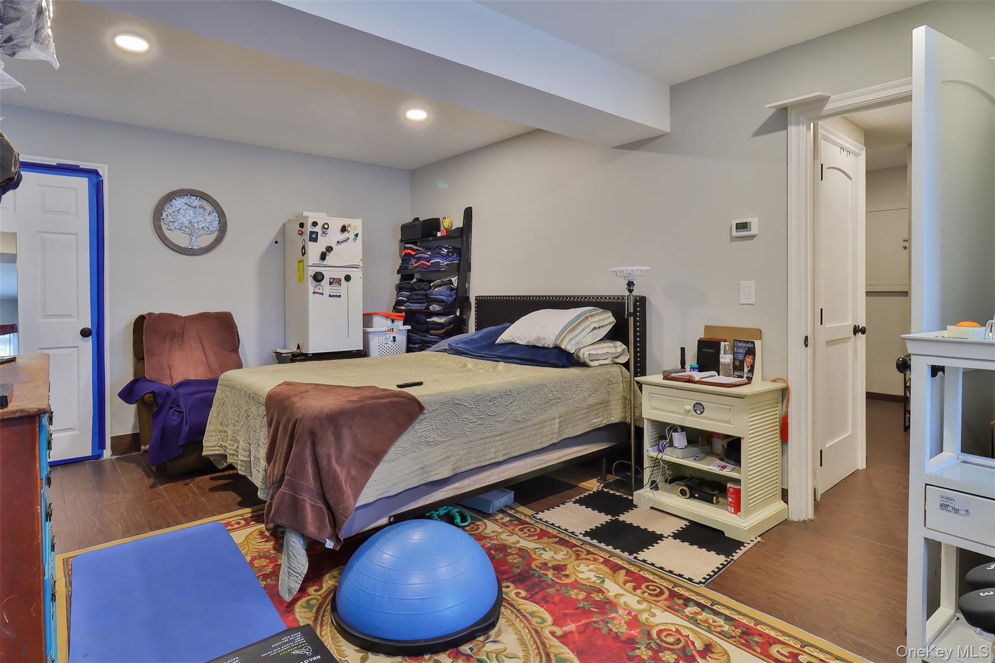 116 B Holbrook Road Holbrook, NY 11741 - Photo 18 of 23 a bedroom with a bed and a chandelier