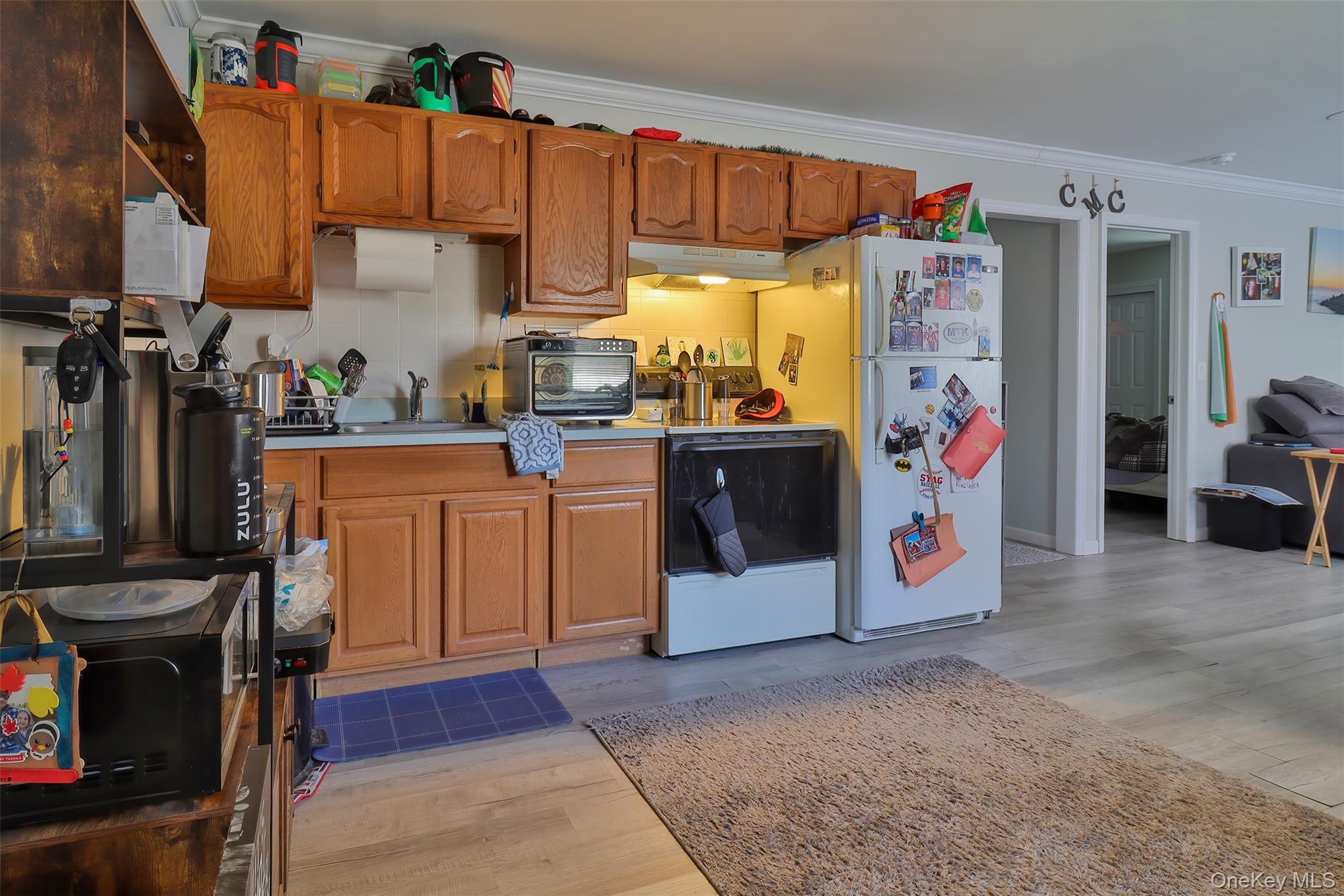 116 B Holbrook Road Holbrook, NY 11741 - Photo 19 of 23 a view of a kitchen with fridge and rack