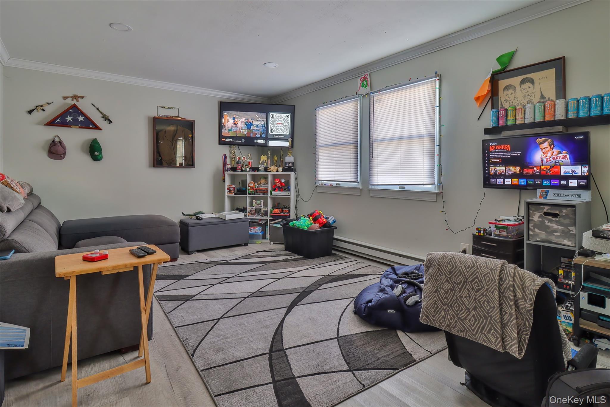 116 B Holbrook Road Holbrook, NY 11741 - Photo 22 of 23 a bedroom with a bed and a flat screen tv