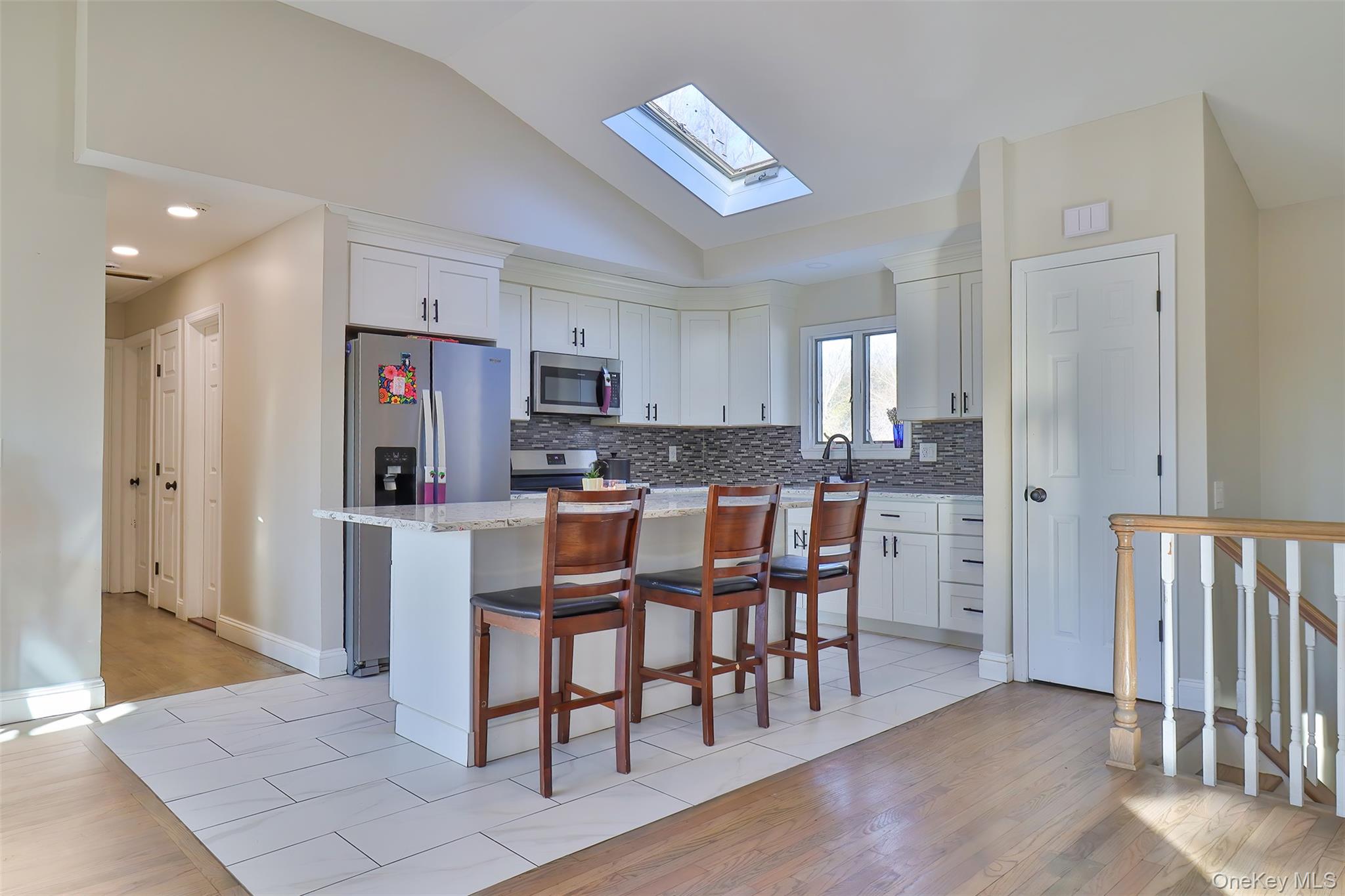 116 B Holbrook Road Holbrook, NY 11741 - Photo 5 of 23 a kitchen with stainless steel appliances granite countertop a refrigerator and a stove top oven