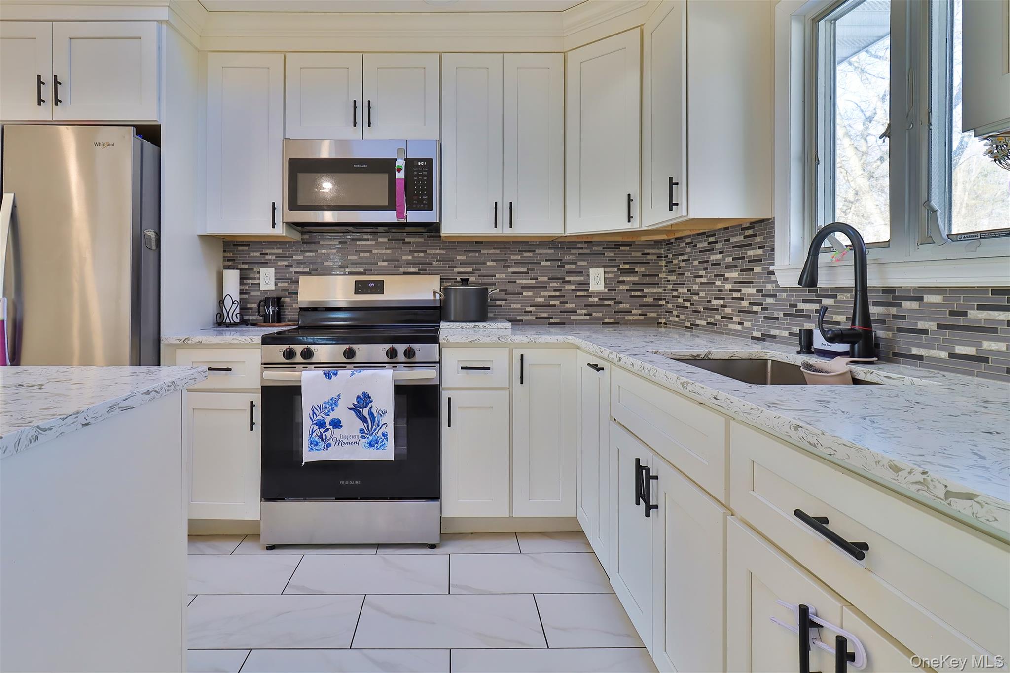 116 B Holbrook Road Holbrook, NY 11741 - Photo 6 of 23 a kitchen with stainless steel appliances granite countertop a stove a sink and a microwave