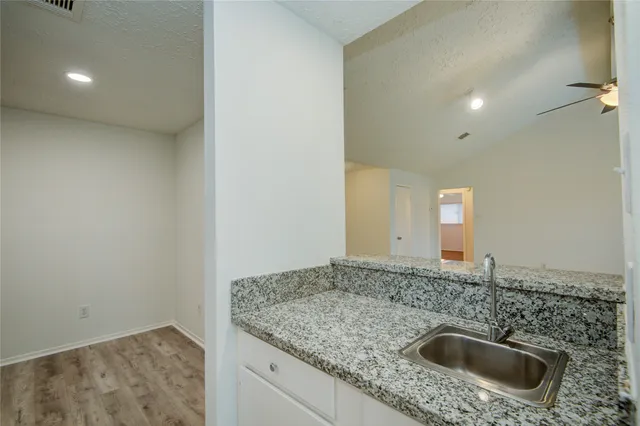a bathroom with a sink and vanity