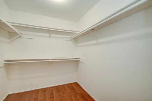 a white toilet sitting next to a shower curtain