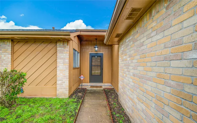 a view of a pathway of a house with backyard