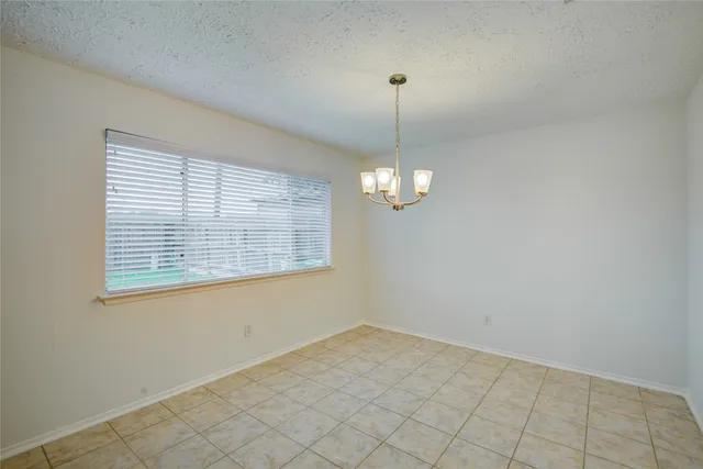 a view of empty room with windows