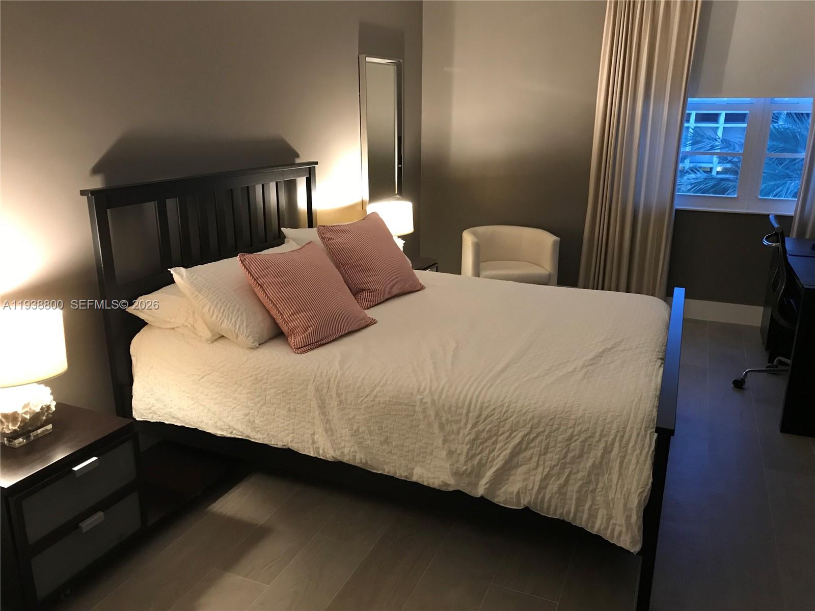 100 Lincoln Road, Unit 314B Miami Beach, FL 33139 - Photo 18 of 44 a bedroom with a bed and walk in closet