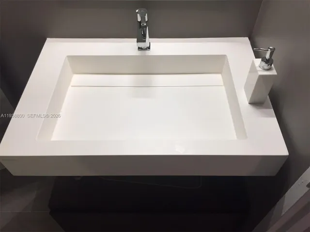 a bathroom with a sink vanity and a mirror