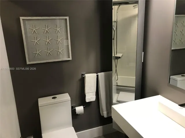 a bathroom with a sink and mirror