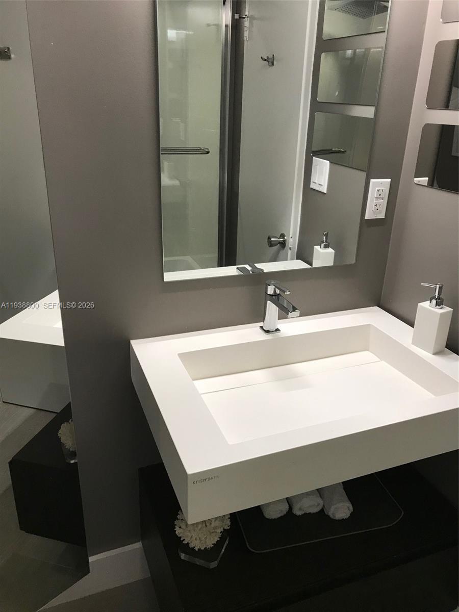 100 Lincoln Road, Unit 314B Miami Beach, FL 33139 - Photo 28 of 44 a bathroom with a sink vanity and a mirror