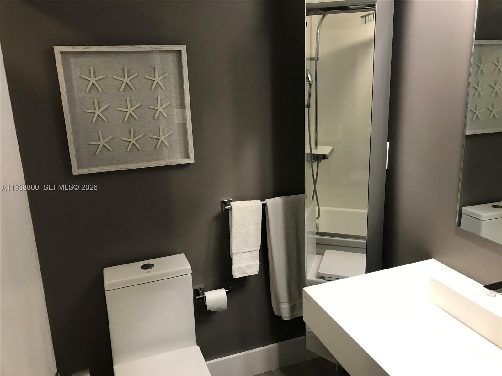 100 Lincoln Road, Unit 314B Miami Beach, FL 33139 - Photo 29 of 44 a bathroom with a toilet and a shower