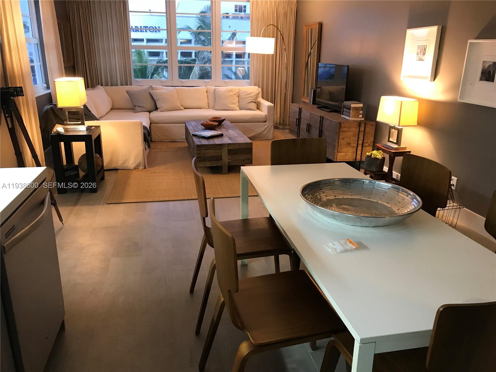 100 Lincoln Road, Unit 314B Miami Beach, FL 33139 - Photo 3 of 44 a living room with furniture and a flat screen tv