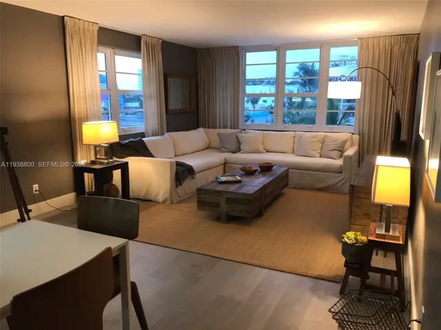 a living room with furniture and a window