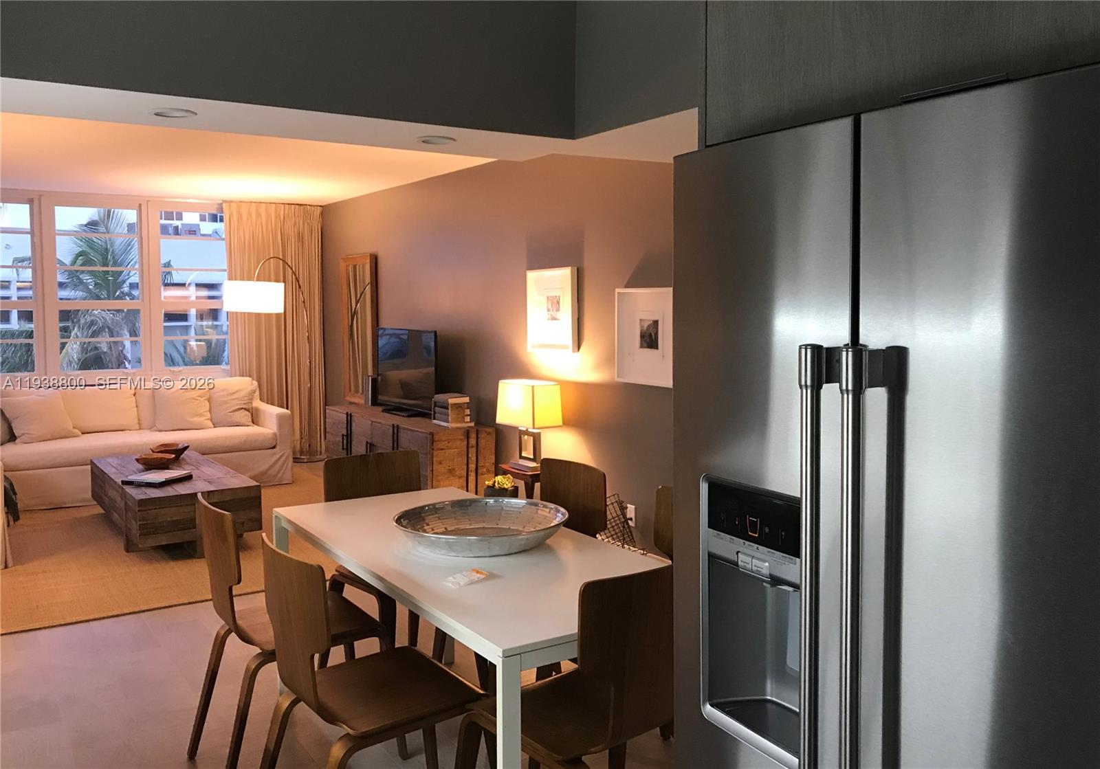 100 Lincoln Road, Unit 314B Miami Beach, FL 33139 - Photo 7 of 43 a view of a dining room with furniture window and wooden floor