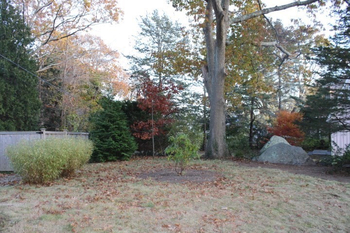 34 R Summer Street Rockport, MA 01966 - Photo 2 of 22 a backyard of a house with lots of green space