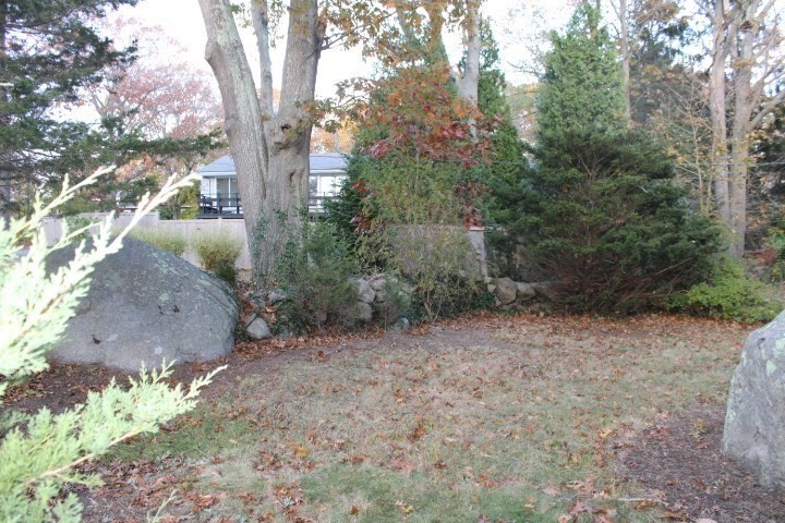 34 R Summer Street Rockport, MA 01966 - Photo 4 of 22 a view of a yard with plants and trees
