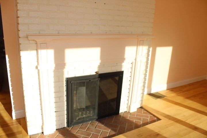 34 R Summer Street Rockport, MA 01966 - Photo 9 of 22 a view of a door and chair in a room