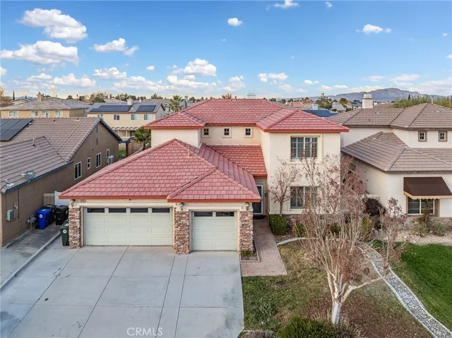 a front view of a building with many windows