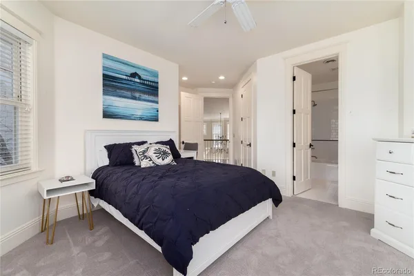 a large bathroom with a double vanity sink a mirror and a bathtub
