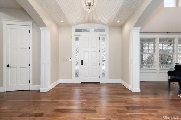 a view of a livingroom with furniture and hardwood floor