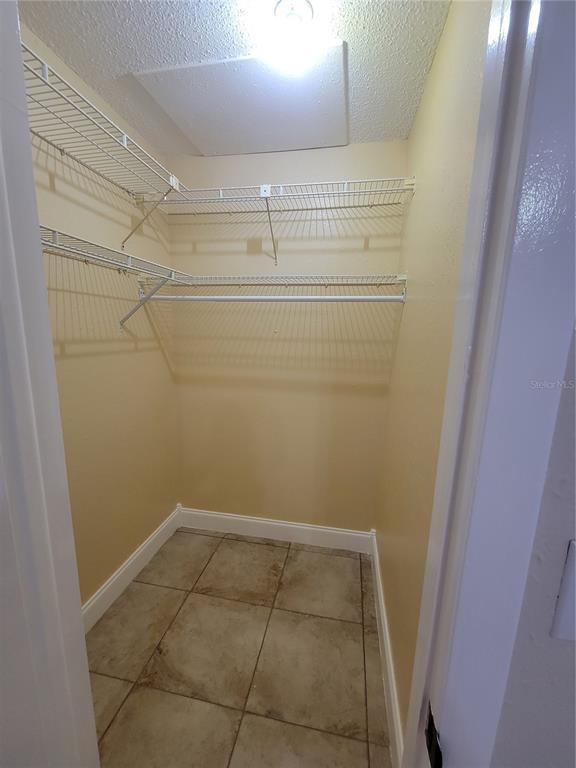 10032 65th Avenue North, Unit 19 St. Petersburg, FL 33708 - Photo 20 of 44 a view of a room with racks on the wall