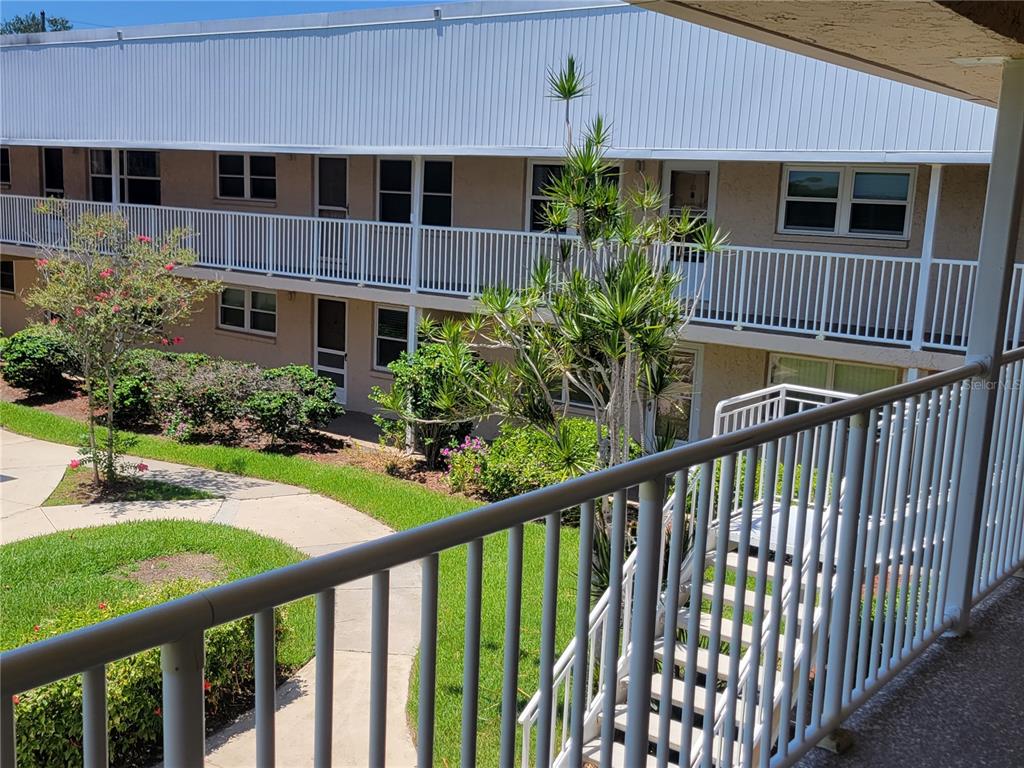 10032 65th Avenue North, Unit 19 St. Petersburg, FL 33708 - Photo 33 of 44 a view of front door and small yard