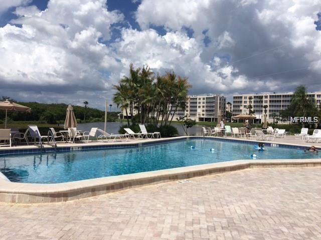 10032 65th Avenue North, Unit 19 St. Petersburg, FL 33708 - Photo 40 of 44 a view of swimming pool and outdoor space