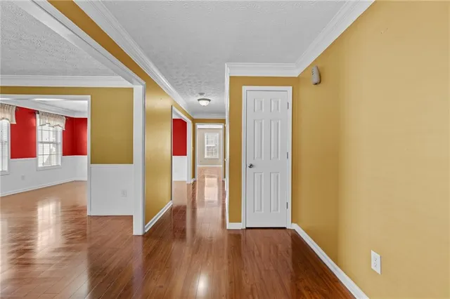 a view of an entryway with wooden floor