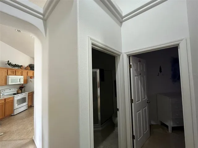 a view of a kitchen from the hallway