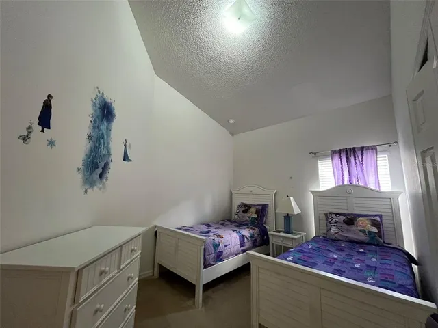 a bedroom with furniture and a fireplace